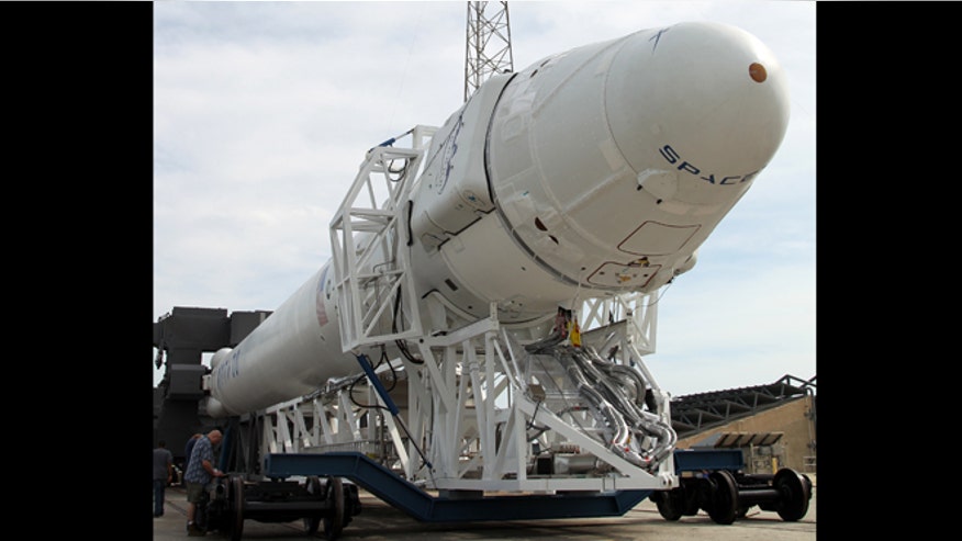 spaceX rocket rolls out.jpg